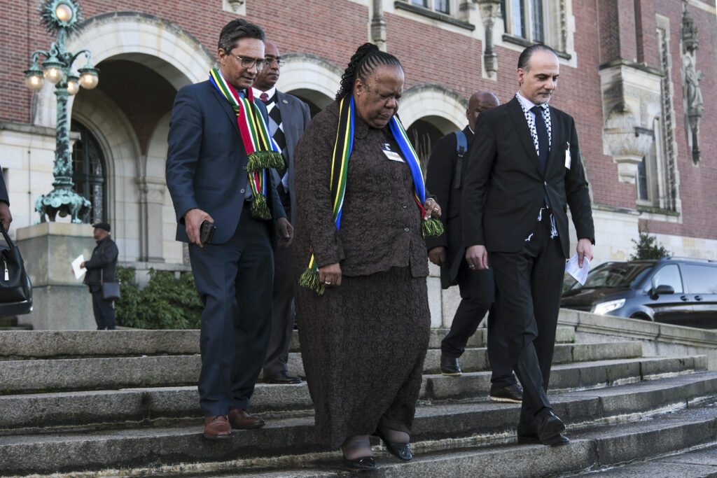South Africa's Foreign Minister Naledi Pandor, center, leaves the building after session of the International Court of Justice, or World Court, in The Hague, Netherlands, Friday, Jan. 26, 2024. The United Nations' top court has stopped short of ordering a cease-fire in Gaza in a genocide case but demanded that Israel try to contain death and damage in its military offensive in the tiny coastal enclave. South Africa brought the case and had asked the court to order Israel to halt its operation. Photo credit: Patrick Post, The Associated Press