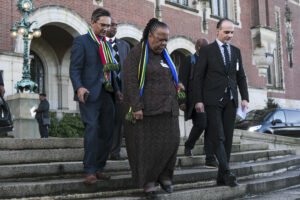 South Africa's Foreign Minister Naledi Pandor, center, leaves the building after session of the International Court of Justice, or World Court, in The Hague, Netherlands, Friday, Jan. 26, 2024. The United Nations' top court has stopped short of ordering a cease-fire in Gaza in a genocide case but demanded that Israel try to contain death and damage in its military offensive in the tiny coastal enclave. South Africa brought the case and had asked the court to order Israel to halt its operation. Photo credit: Patrick Post, The Associated Press