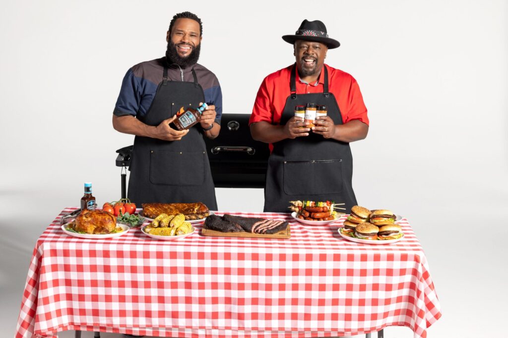 Anthony Anderson, left, and Cedric the Entertainer on the set of "Kings of BBQ." Photo credit: A & E Entertainment Network.