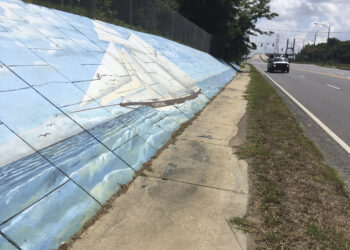 Traffic passes a mural along Africatown Boulevard in Mobile, Alabama, on Thursday, May 30, 2019. Photo credit: Kevin McGill, The Associated Press