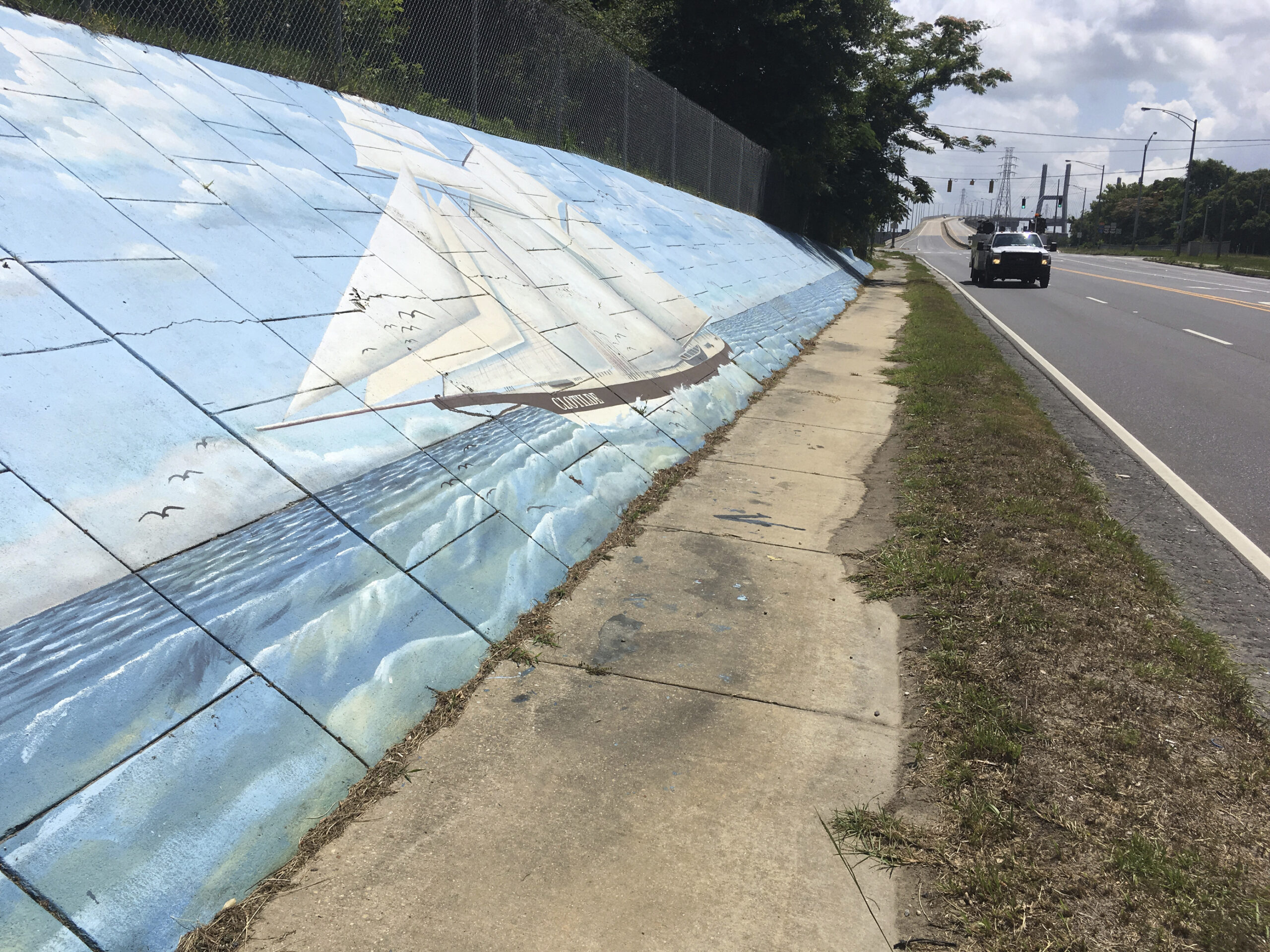 Traffic passes a mural along Africatown Boulevard in Mobile, Alabama, on Thursday, May 30, 2019. Photo credit: Kevin McGill, The Associated Press