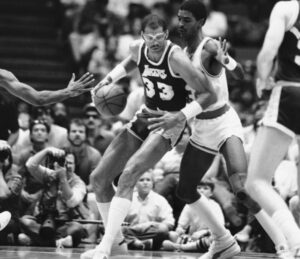 Retired Los Angeles Laker Kareem Abdul-Jabbar (number 33) and the Houston Rockets' Ralph Sampson as Abdul-Jabbar moves for a basket in the first period of the Western Conference playoffs of the NBA in Houston on Friday, May 16, 1986. Photo credit: The Associated Press