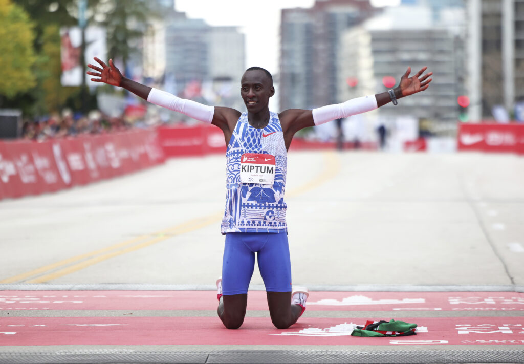 Kelvin Kiptum celebrates his Chicago Marathon world record victory in Chicago's Grant Park on Sunday, Oct. 8, 2023. Kiptum was killed along with his coach in a car crash in Kenya late Sunday, Feb. 11, 2024. Photo credit: Eileen T. Meslar , The Chicago Tribune via The Associated Press