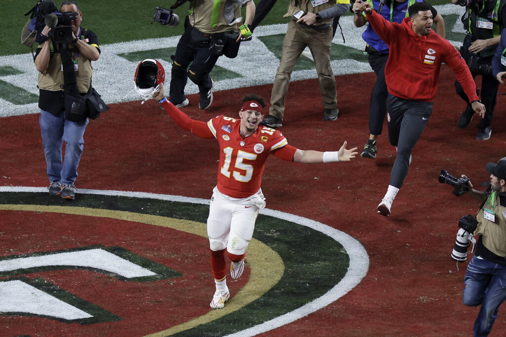 Kansas City Chiefs quarterback Patrick Mahomes celebrates after throwing the game-winning touchdown against the San Francisco 49ers during overtime of the NFL Super Bowl 58 football game Sunday, Feb. 11, 2024, in Las Vegas. Photo credit: Adam Hunger, The Associated Press