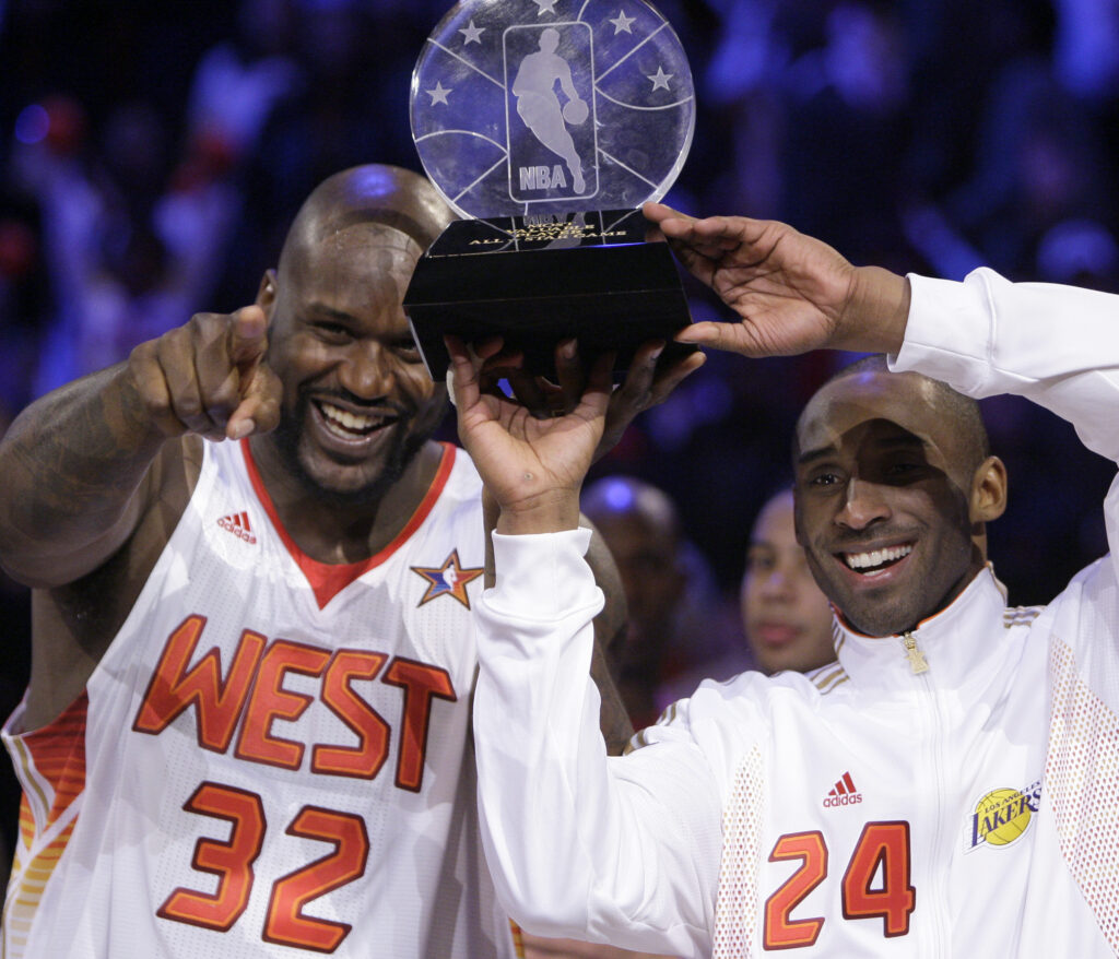 Western All-Star Shaquille O'Neal (32) of the Phoenix Suns and Western All-Star Kobe Bryant (24) of the Los Angeles Lakers share the MVP award after the NBA All-Star basketball game Sunday, Feb. 15, 2009, in Phoenix. Photo credit: Ross D. Franklin, The Associated Press