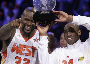 Western All-Star Shaquille O'Neal (32) of the Phoenix Suns and Western All-Star Kobe Bryant (24) of the Los Angeles Lakers share the MVP award after the NBA All-Star basketball game Sunday, Feb. 15, 2009, in Phoenix. Photo credit: Ross D. Franklin, The Associated Press