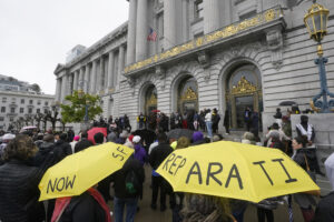 A crowd listens to speakers at a reparations rally outside of City Hall in San Francisco, California, on March 14, 2023. San Francisco's supervisors will offer a formal apology to Black residents for decades of racist laws and policies perpetrated by the city. All 11 supervisors have signed on as sponsors of an apology resolution to be voted on Tuesday, Feb. 27, 2024. Photo credit: Jeff Chiu, The Associated Press