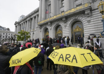 A crowd listens to speakers at a reparations rally outside of City Hall in San Francisco, California, on March 14, 2023. San Francisco's supervisors will offer a formal apology to Black residents for decades of racist laws and policies perpetrated by the city. All 11 supervisors have signed on as sponsors of an apology resolution to be voted on Tuesday, Feb. 27, 2024. Photo credit: Jeff Chiu, The Associated Press