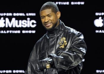 Usher poses for photographers during a news conference ahead of the Super Bowl 58 NFL football game Thursday, Feb. 8, 2024, in Las Vegas. Usher will perform during the Super Bowl halftime show. Photo credit: John Locher, The Associated Press