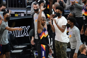 Phoenix Suns guard Chris Paul acknowledges the fans after recording his 10,000th career assist during the second half of an NBA basketball game against the Los Angeles Lakers, Sunday, March 21, 2021, in Phoenix. Photo credit: Rick Scuteri