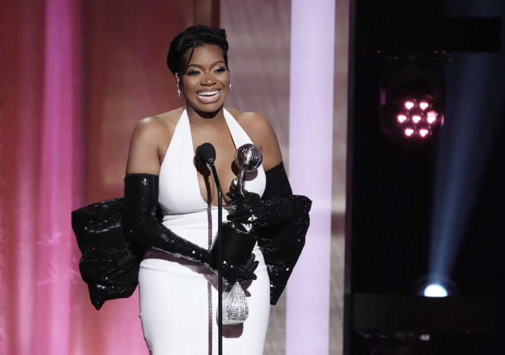 Fantasia Barrino, a cast member in "The Color Purple," accepts the award for Outstanding Actress in a Motion Picture during the 55th NAACP Image Awards, Saturday, March 16, 2024, at The Shrine Auditorium in Los Angeles. Photo credit: Chris Pizzello, The Associated Press