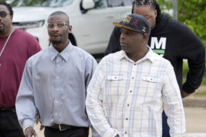 Michael Corey Jenkins, left, and Eddie Terrell Parker walk toward the Thad Cochran United States Courthouse in Jackson, Mississippi, on Thursday, March 21, 2024, for sentencing of the fifth of the six former Mississippi Rankin County law enforcement officers who committed numerous acts of racially motivated, violent torture on them in 2023. The six former law officers pleaded guilty to a number of federal charges for torturing the two Black men and their sentencing began Tuesday in federal court. Photo credit: Rogelio V. Solis, The Associated Press