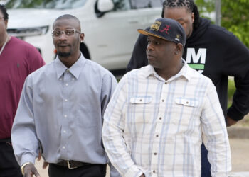 Michael Corey Jenkins, left, and Eddie Terrell Parker walk toward the Thad Cochran United States Courthouse in Jackson, Mississippi, on Thursday, March 21, 2024, for sentencing of the fifth of the six former Mississippi Rankin County law enforcement officers who committed numerous acts of racially motivated, violent torture on them in 2023. The six former law officers pleaded guilty to a number of federal charges for torturing the two Black men and their sentencing began Tuesday in federal court. Photo credit: Rogelio V. Solis, The Associated Press