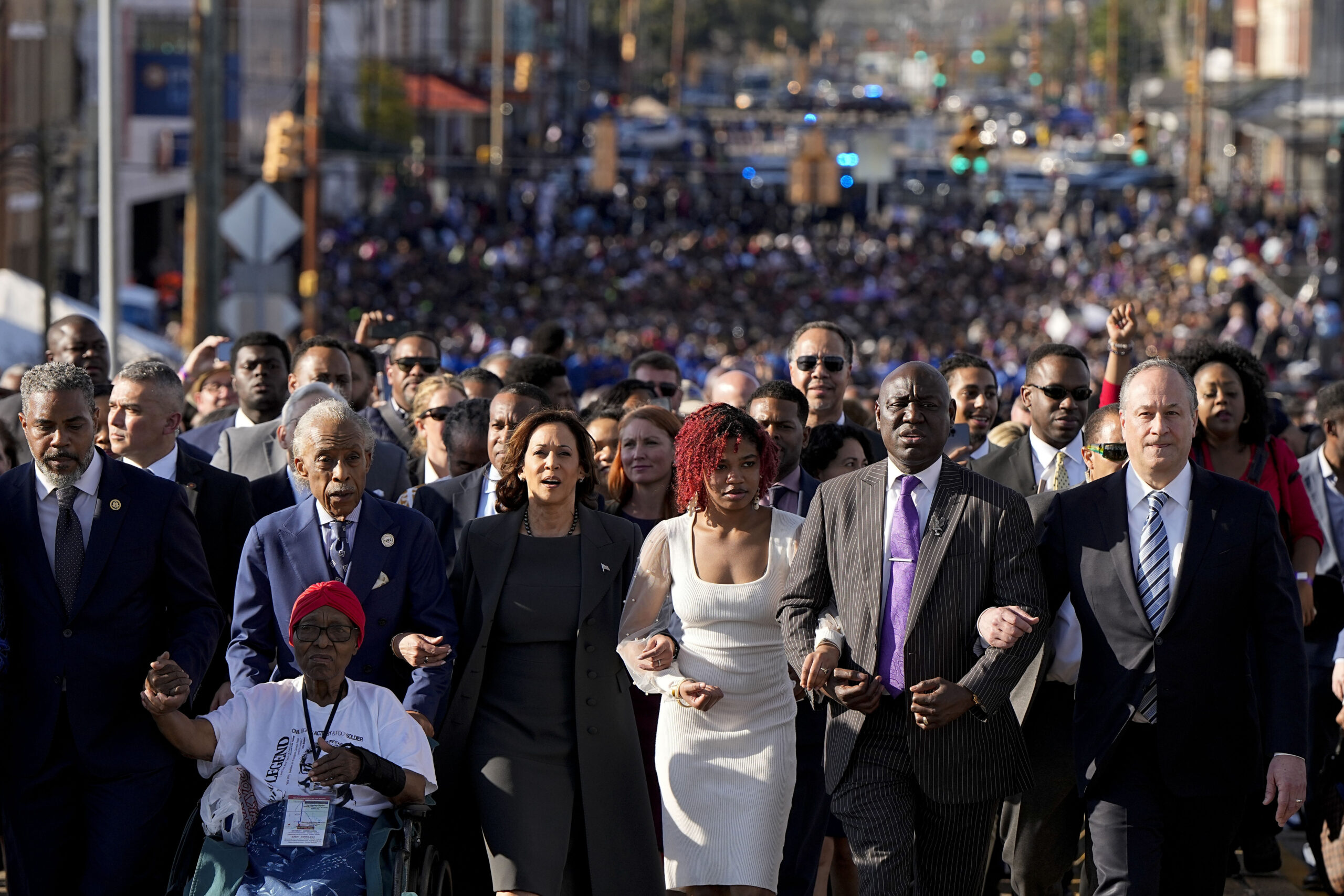 Left to right: The Rev. Al Sharpton, Vice President Kamala Harris, civil rights lawyer Ben Crump, and Douglas Emhoff, second gentleman of the United States, walk with hundreds of people across the Edmund Pettus Bridge commemorating the 59th anniversary of the Bloody Sunday voting rights march in 1965, Sunday, March 3, 2024, in Selma, Alabama. Photo credit: Mike Stewart, The Associated Press