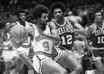 In this Sept. 22, 1973, file photo, Randy Smith of the Buffalo Braves (9) drives for a basket as Don Chaney of the Boston Celtics (12) moves in during an exhibition game in New York's Madison Square Garden. The former NBA player died in 2009 following a career in which he starred for the Buffalo Braves in the 1970s. Photo credit: The Associated Press