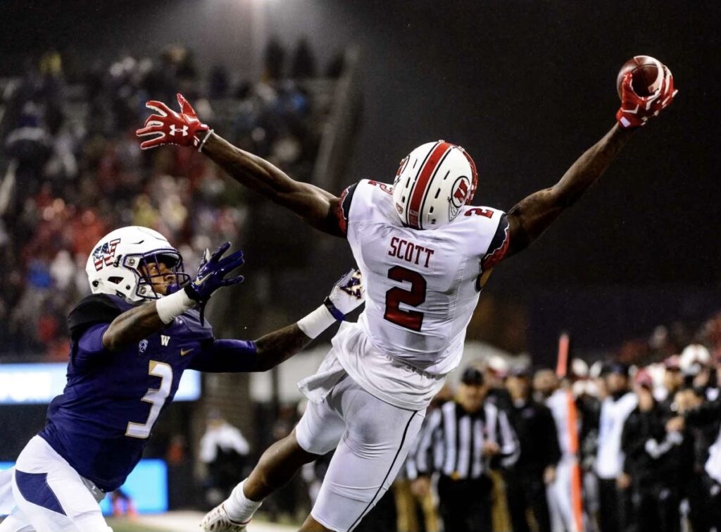 Utah Utes' wide receiver Kenneth Scott (2) reaches out for a one-handed grab as the University of Utah faces the University of Washington, NCAA football at Husky Stadium in Seattle, Saturday November 7, 2015. Defending is Washington Huskies defensive back Darren Gardenhire (3). Photo credit: Trent Nelson, The Salt Lake Tribune via Kenneth Scott