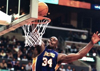 Then-Los Angeles Lakers center Shaquille O'Neal dunks the ball during the game against the Los Angeles Clippers Monday, March 6, 2000. In this season of campaigns, Shaquille O'Neal made a convincing pitch to MVP voters — a career-high 61 points. "It's a good feeling," O'Neal said after the Los Angeles Lakers beat the Clippers 123-103 for their 16th consecutive victory, equaling their longest winning streak of the season. Photo credit: E.J. Flynn, The Associated Press