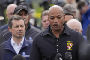 Maryland Gov. Wes Moore, accompanied by Transportation Secretary Pete Buttigieg and other officials, speaks during a news conference near the scene where a container ship collided with a support on the Francis Scott Key Bridge, in Dundalk, Maryland, Tuesday, March 26, 2024. Photo credit: Matt Rourke, The Associated Press