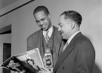 Griffith J. Davis, left, and Langston Hughes, right, reading Ebony at Hughes' Morehouse College faculty apartment in 1947. Photo credit: Griffith J. Davis Photographs and Archives