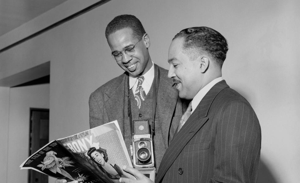 Griffith J. Davis, left, and Langston Hughes, right, reading Ebony at Hughes' Morehouse College faculty apartment in 1947. Photo credit: Griffith J. Davis Photographs and Archives