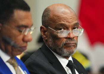 Haiti's Prime Minister Ariel Henry, right, attends a working session at the Canada-CARICOM Summit in Ottawa, Ontario, Oct. 18, 2023. Henry resigned on April 25, 2024, leaving the way clear for a new government to be formed in the Caribbean country. Photo credit: Sean Kilpatrick, The Canadian Press via The Associated Press