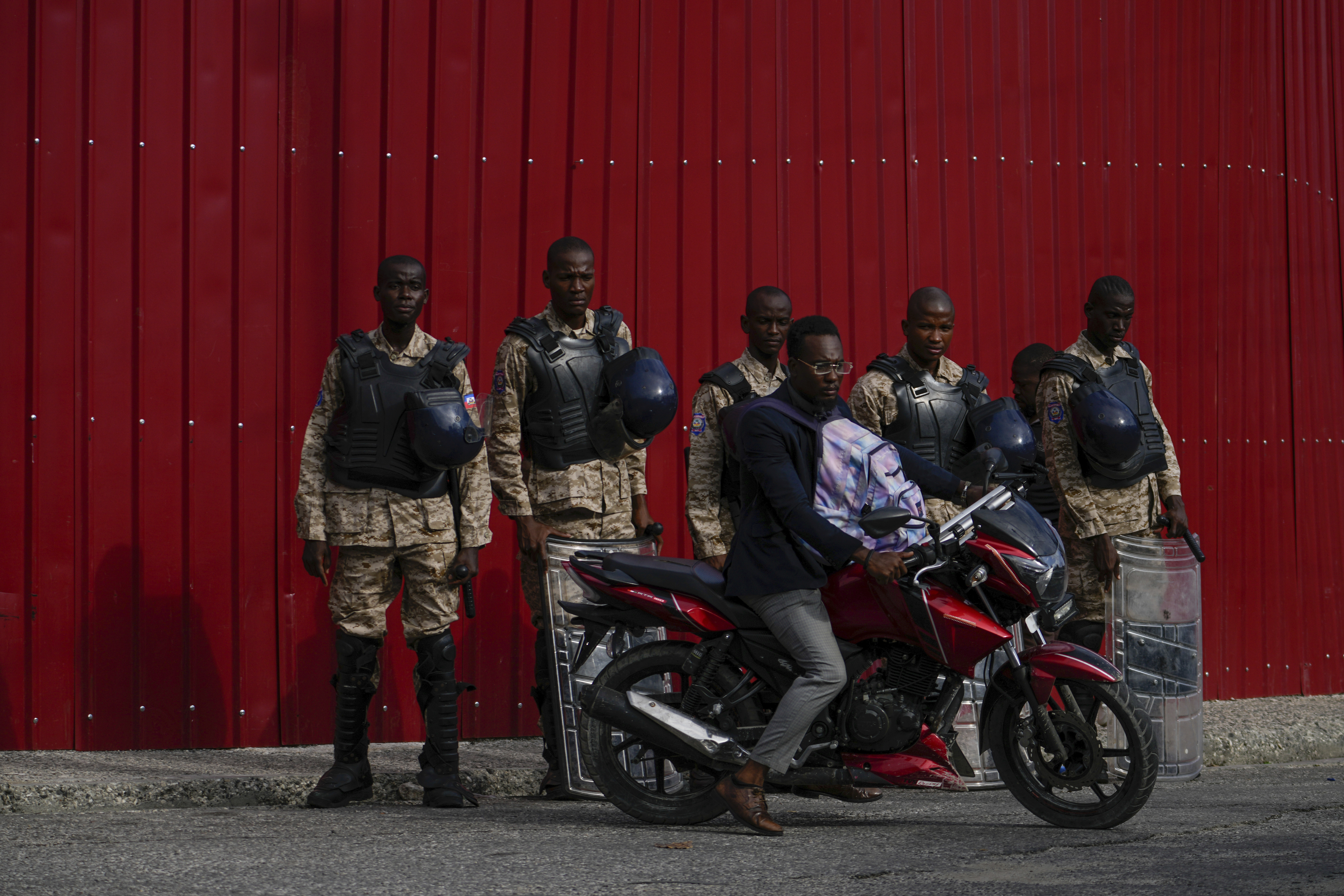 Police stand guard outside the Prime Minister's office in Port-au-Prince, Haiti, Thursday, April 25, 2024. A transitional council tasked with selecting a new prime minister and cabinet is expected to be sworn in on Thursday. Photo credit: Ramon Espinosa, The Associated Press
