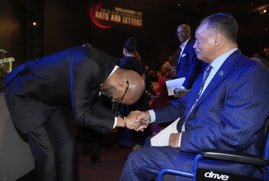 The Rev. Frederick D. Haynes III, left, bows while greeting the Rev. Jesse Jackson before speaking in Dallas, Texas, on Feb. 1, 2024. Haynes is stepping down less than three months after assuming the leadership role of the Rainbow PUSH Coalition, the civil rights group founded by Jackson in the 1970s. Photo credit: LM Otero, The Associated Press