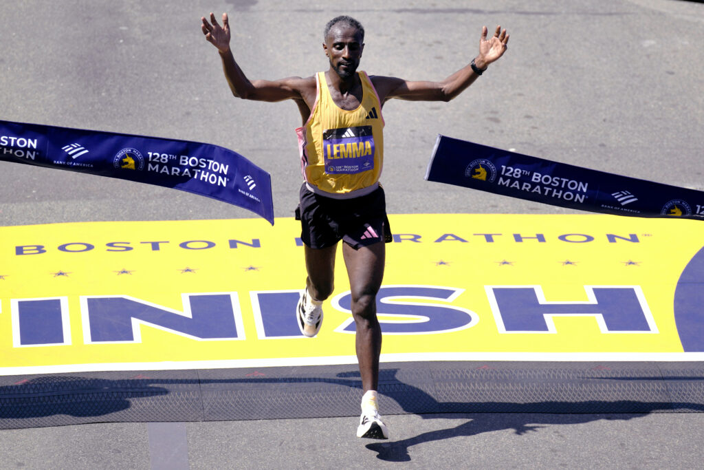 Sisay Lemma of Ethiopia breaks the tape to win the men's race at the Boston Marathon on Monday, April 15, 2024. Photo credit: Charles Krupa, The Associated Press