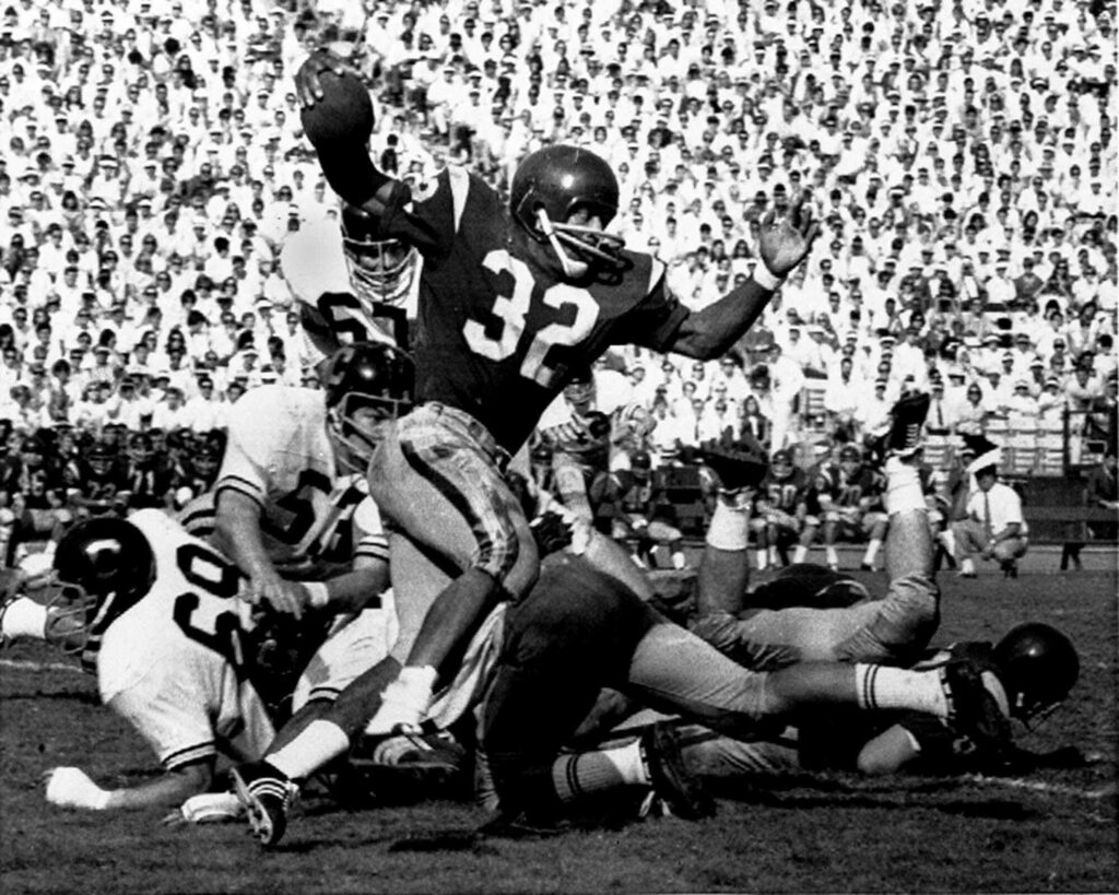 In this Nov. 9, 1968, file photo, the University of Southern California's O.J. Simpson, number 32, runs against California during a college football game in Los Angeles. Simpson won the Heisman Trophy while at USC in 1968. Photo credit: Heisman Foundation/The Associated Press