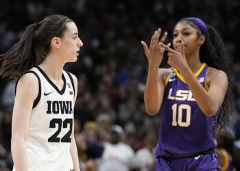 LSU's Angel Reese reacts in front of Iowa's Caitlin Clark during the second half of the NCAA Women's Final Four championship basketball game April 2, 2023, in Dallas. Iowa and LSU are getting ready to meet again in a rematch of the 2023 national championship game on Monday, April 1, 2024. Photo credit: Tony Gutierrez, The Associated Press