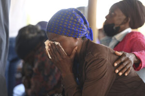 Family members of the bus crash victims gather at the ZCC Church in the Molepolole village near Gaborone, Botswana, Friday, March 29, 2024. A bus carrying Easter pilgrims from Botswana to Moria in South Africa crashed en route in Mokopane, South Africa, claiming the lives of some 45 people. An 8-year-old survived. Photo credit: The Associated Press