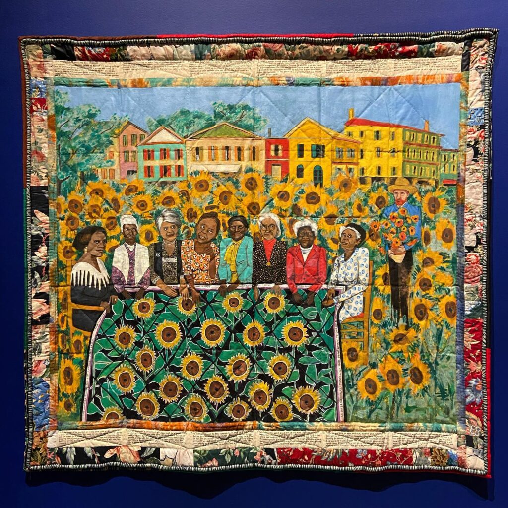 The Sunflower Quilting Bee at Arles, a 1996 lithograph by the late Faith Ringgold that features images of prominent Black women in history, was in the private collection of Oprah Winfrey as of 2022. Photo credit: Heidi De Vries