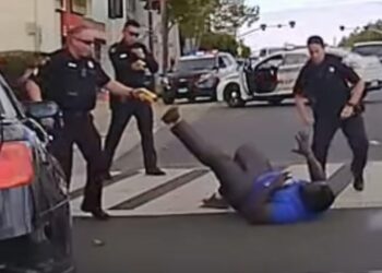 In this image from video provided by the San Mateo County Sheriff's Office, Chinedu Okobi lies on the ground in Millbrae, California, on Oct. 3, 2018, during a police encounter where officers used a stun gun, chemical spray, baton strikes and prone restraint in a sequence of rapid escalation. San Mateo County deputies told the district attorney they were reacting to what they perceived as Okobi's "superhuman strength." Photo credit: San Mateo County Sheriff's Office via The Associated Press