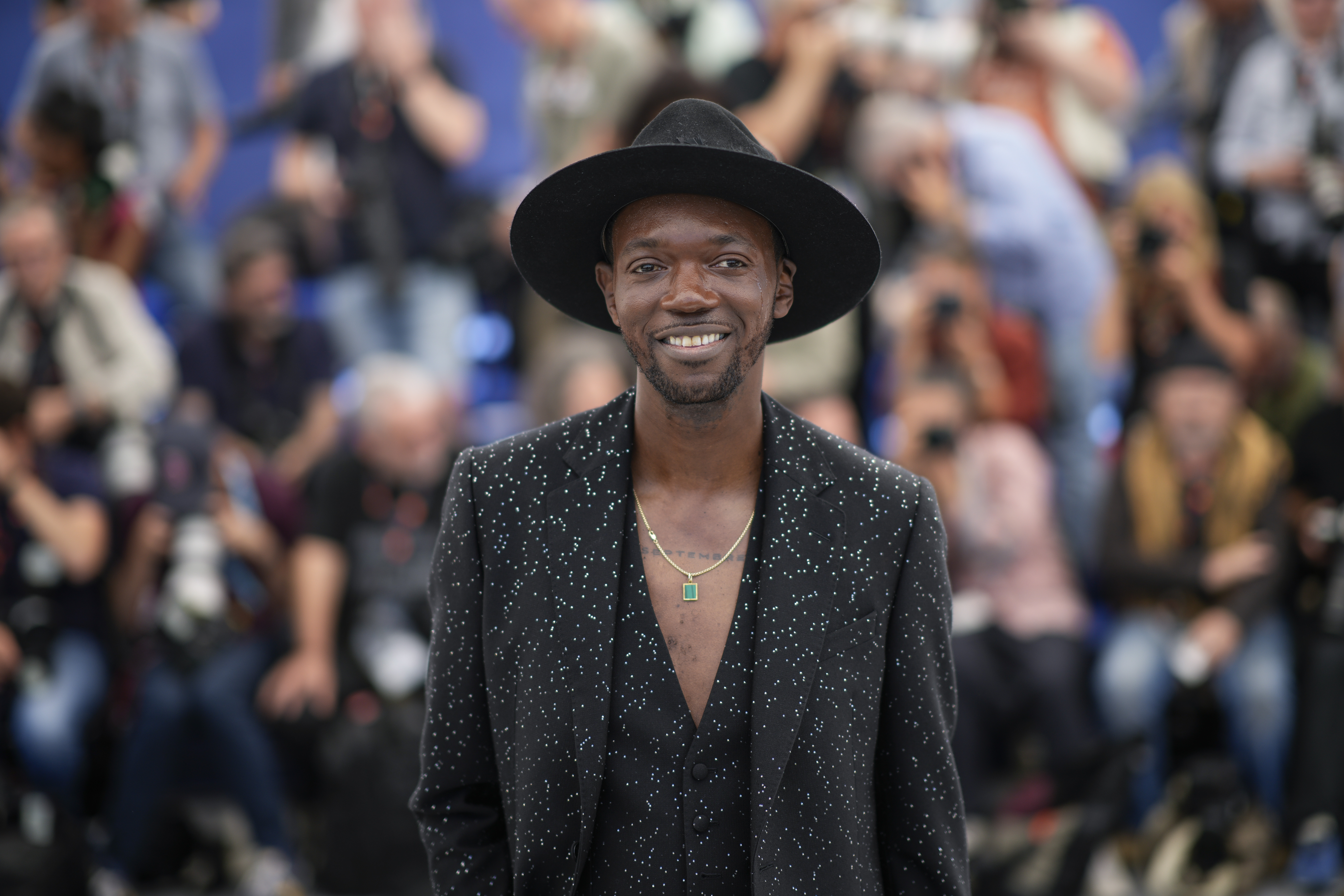 Baloji poses for photographers at the photo call for the film "Omen" at the 76th International Film Festival, Cannes, southern France, Monday, May 22, 2023. Photo credit: Daniel Cole, The Associated Press