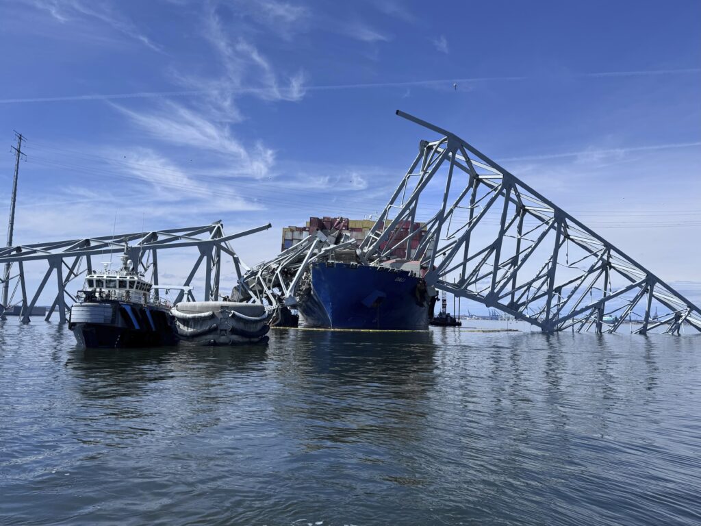 The fallen Francis Scott Key Bridge in Baltimore is pictured Sunday, March 31, 2024, where divers assisted crews with the complicated and meticulous operation of removing steel and concrete. Photo credit: Mike Pesoli, The Associated Press
