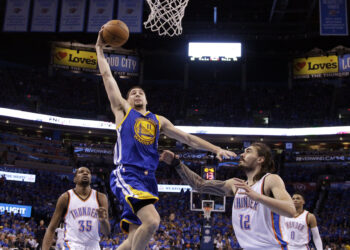 Golden State Warriors guard Klay Thompson (11) shoots over Oklahoma City Thunder center Steven Adams (12) during the second half in Game 6 of the NBA basketball Western Conference finals in Oklahoma City, Oklahoma, on Saturday, May 28, 2016. The Warriors won 108-101. Photo credit: Sue Ogrocki, The Associated Press