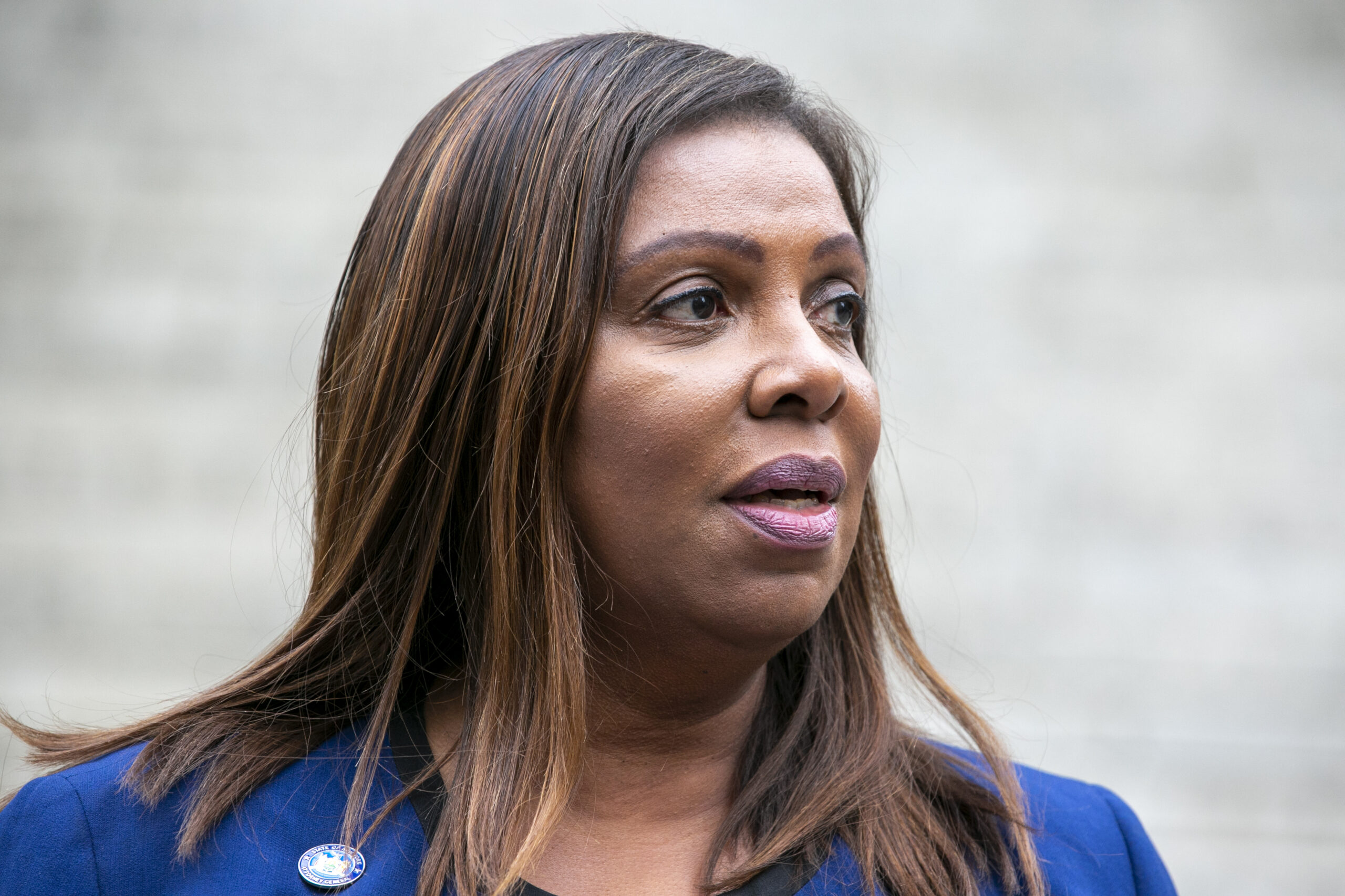 New York Attorney General Letitia James speaks in October outside the courthouse where former President Donald Trump's New York civil fraud trial was underway. The case was brought by James. Photo credit: Ted Shaffrey, The Associated Press