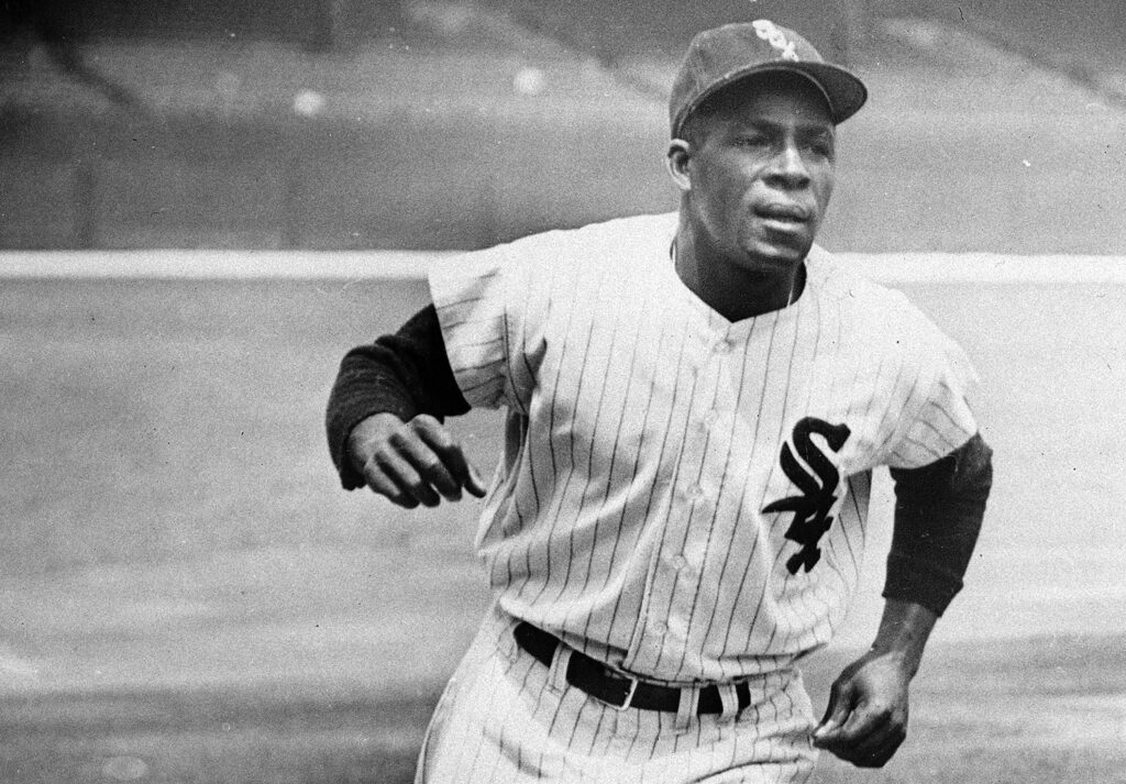 Minnie Minoso, Chicago White Sox outfielder, practices running the bases at Comiskey Park in Chicago, June 1, 1955. Major League Baseball said Tuesday, May 28, 2024, that it has incorporated records for more than 2,300 Negro Leagues players following a three-year research project. Miñoso was credited with 150 hits with the New York Cubans of the second Negro National League from 1946-1948, raising his total to 2,113. Photo credit: The Associated Press