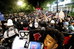 Black Lives Matter protesters march through Portland, Oregon, after rallying at the Mark O. Hatfield United States Courthouse on Sunday, Aug. 2, 2020. Protests, rallies, sit-ins, marches and disruptions are hallmarks of American history. Photo credit: Noah Berger, The Associated Press