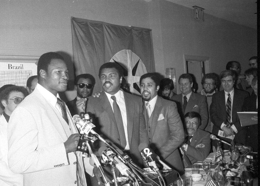 Muhammad Ali heckles Larry Holmes, left, during a news conference in New York on April 28, 1980. Photo credit: The Associated Press 