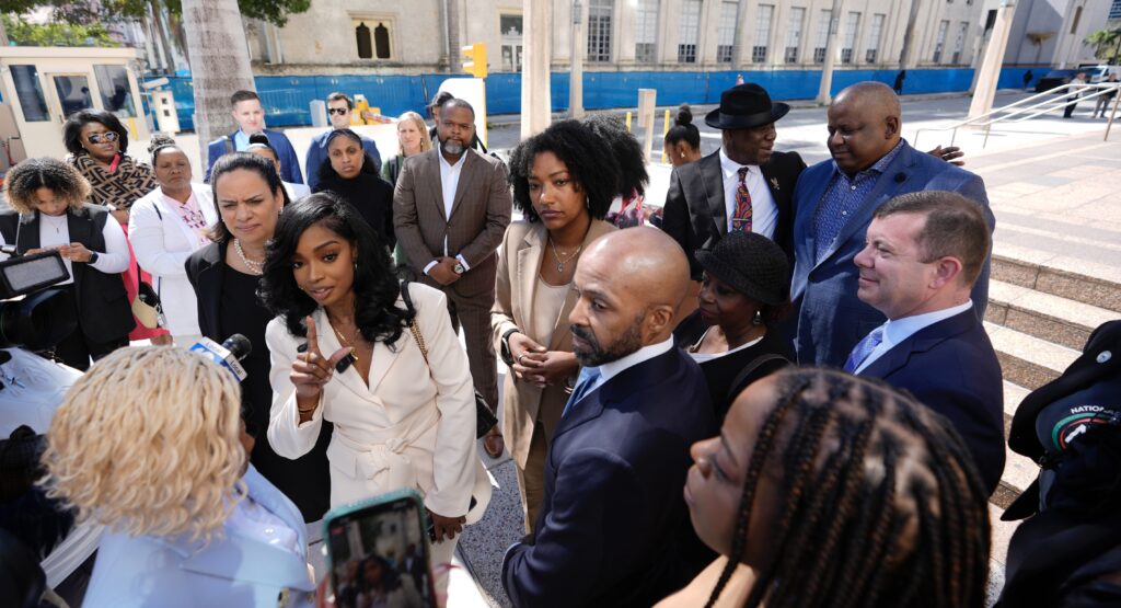 Arian Simone, center left, and Ayana Parsons, center right, cofounders and CEOs of The Fearless Fund, speak to journalists outside federal court in Miami on Jan. 31, 2024. A U.S. federal court of appeals panel suspended the venture capital firm's grant program for Black women business owners, ruling that a conservative group is likely to prevail in its lawsuit claiming that the program is discriminatory. Photo credit: Rebecca Blackwell, The Associated Press