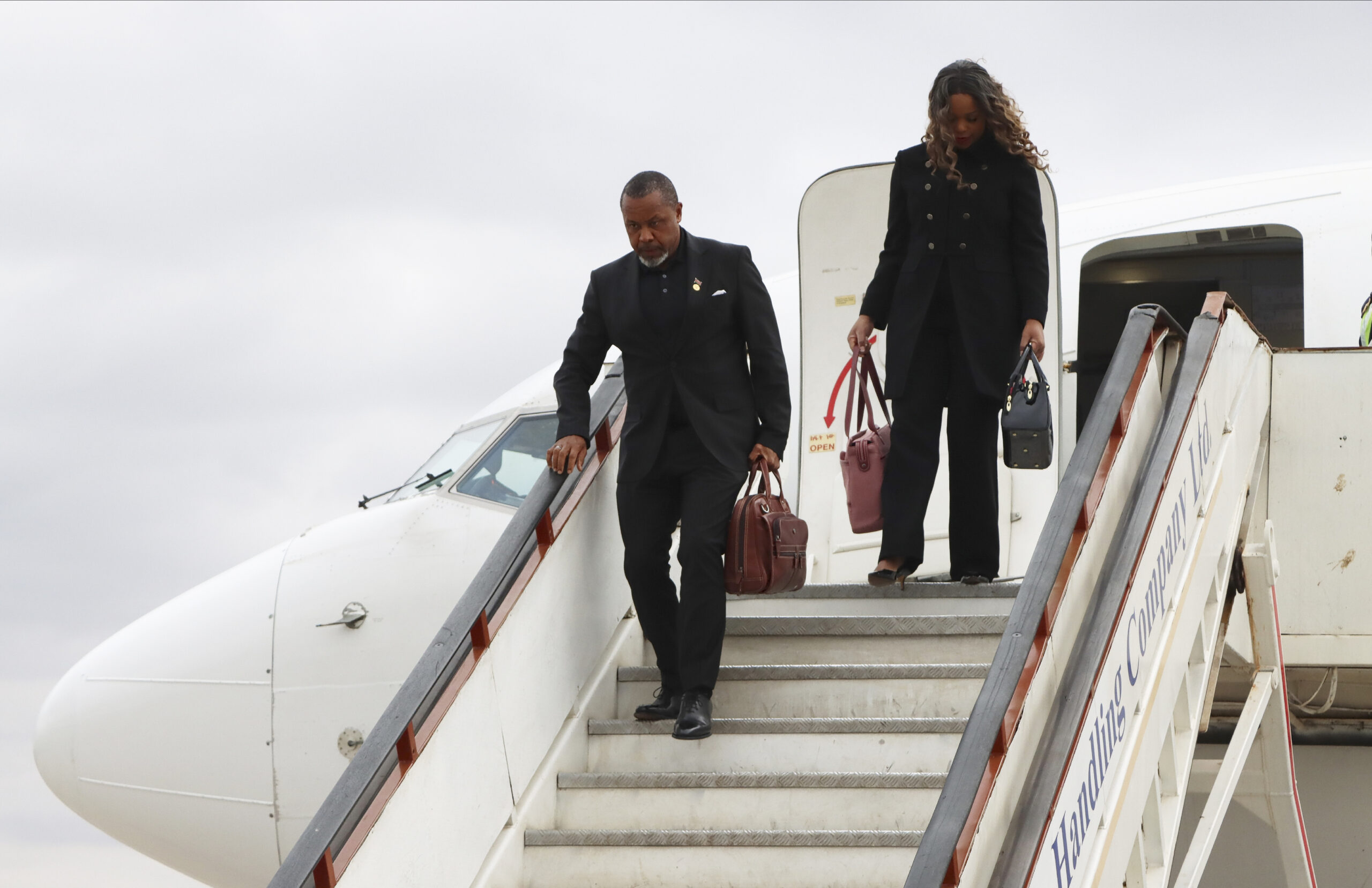 Malawi Vice President Saulos Chilima,left, and his wife Mary disembark from a plane upon his return from South Korea in Lillongwe on Sunday, June 9, 2024. Malawi’s vice president and nine others have been killed in a plane crash, the country’s president said Tuesday. The wreckage of the military plane carrying Chilima was located in a mountainous area in the north of the country after a search that lasted more than a day. There were no survivors of the crash, Malawian President Lazarus Chakwera said. Chakwera made the announcement in a live address on state television. Photo credit: The Associated Press
