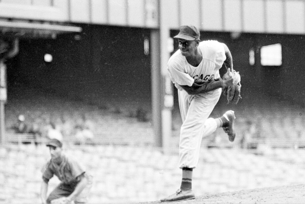 In this Aug. 17, 1961, file photo, pitcher Leroy "Satchel" Paige is shown in action during the Negro American League 29th East-West All Star game at New York's Yankee Stadium.  Photo credit: Harry Harris, The Associated Press