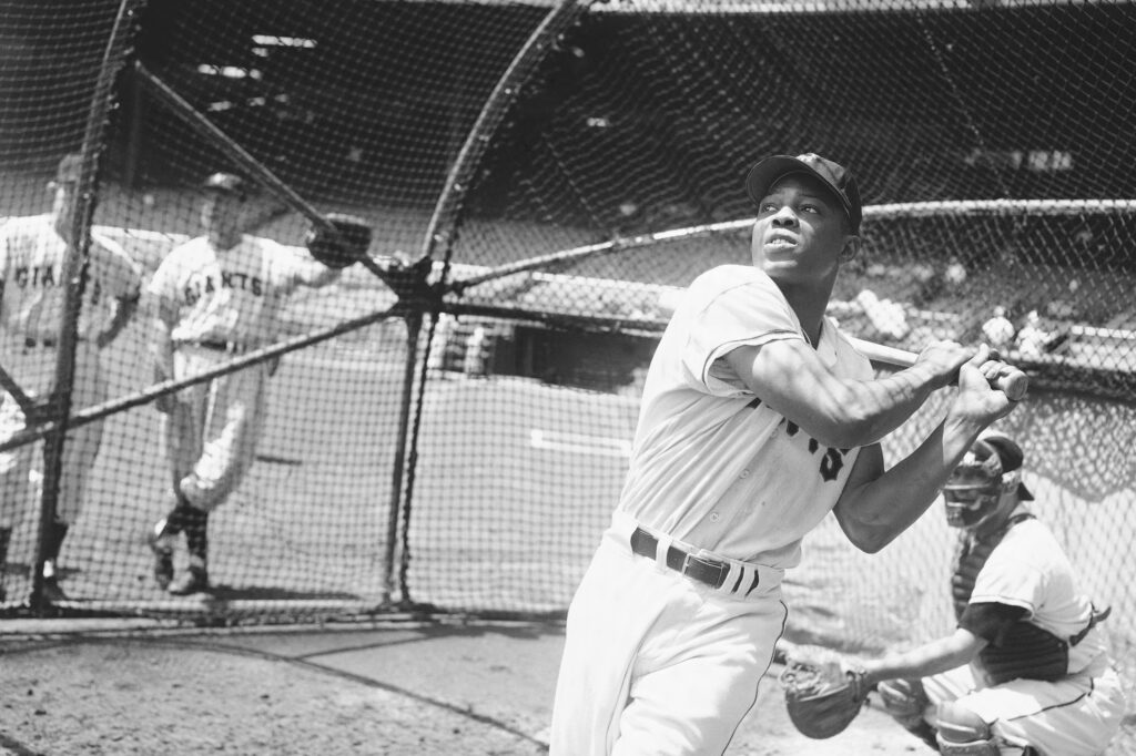 Willie Mays, then with the New York Giants, takes a batting practice swing on June 24, 1954, in New York. Photo credit: John Lent, The Associated Press