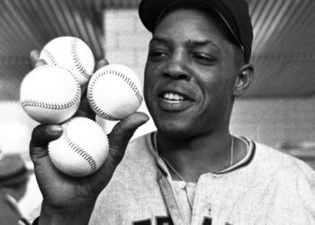 Then-San Francisco Giants outfielder Willie Mays displays the four baseballs in the clubhouse representing the four homers which he hit against the Milwaukee Braves, April 30, 1961, in Milwaukee. Mays, the electrifying “Say Hey Kid” whose singular combination of talent, drive and exuberance made him one of baseball’s greatest and most beloved players, has died. He was 93. Mays' family and the San Francisco Giants jointly announced Tuesday night, June 18, 2024, he had “passed away peacefully” Tuesday afternoon surrounded by loved ones. Photo credit: The Associated Press