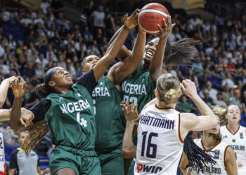 Germany's Alina Hartmann, right, tries to get the ball against, from right, Blessing Ejiofor, Lauren Ebo and Elizabeth Balogun from Nigeria during the Women International Basketball match between Germany and Nigeria at the Uber Arena in Berlin, Friday July 19, 2024. Photo credit: Andreas Gora, German Press Agency via The Associated Press