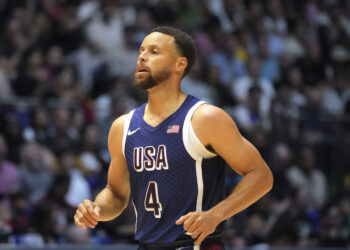 Stephen Curry waits to play during an exhibition basketball game between the United States and South Sudan, at the o2 Arena in London, Saturday, July 20, 2024. Photo credit: Kin Cheung, The Associated Press