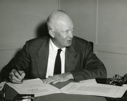 President Dwight Eisenhower signs the Civil Rights Bill of 1957. Photo courtesy the Dwight D. Eisenhower Presidential Library, Museum, & Boyhood Home
