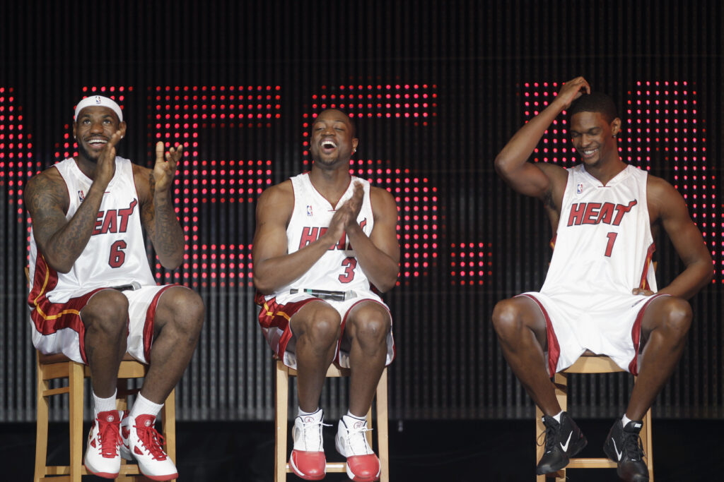 LeBron James, (6), Dwyane Wade, (3), and Chris Bosh (1) appear at Fan Fest Friday, July 9, 2010, in Miami.  Photo credit: J. Pat Carter, The Associated Press