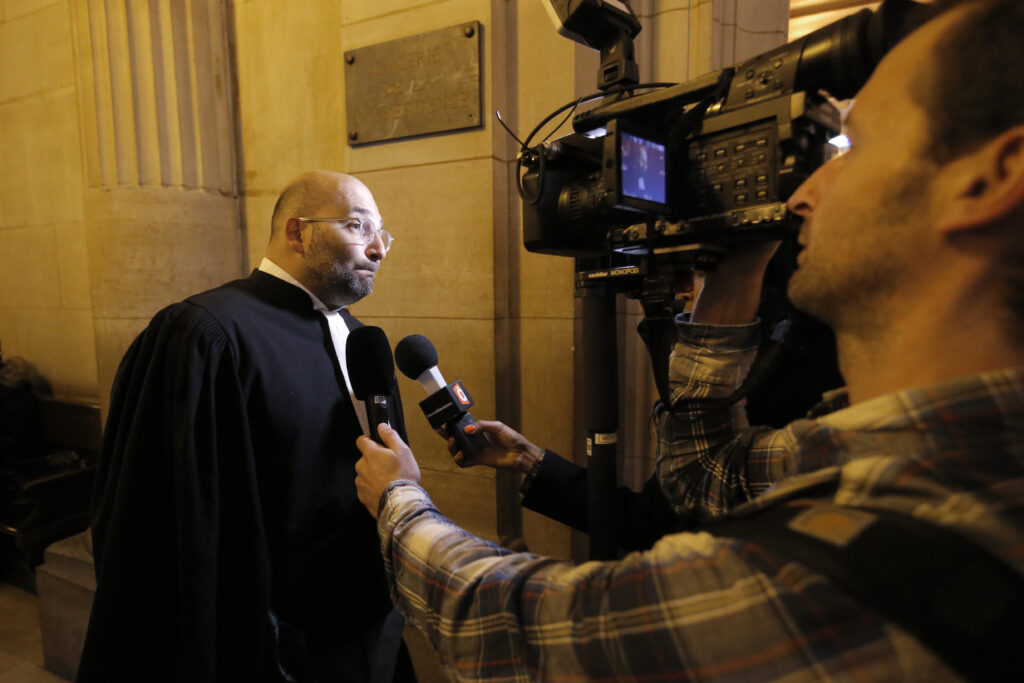 French lawyer Slim Ben Achour talks to the media in Paris, France, on Feb. 25, 2015, in a racial profiling case brought by 13 men of Black or North African origin who allege they've been victims of unjustified police identity checks. Photo credit: Francois Mori, The Associated Press